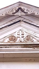 Low angle view of statue against building