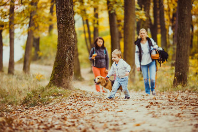 Full length of father and daughter in forest