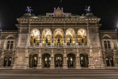 Facade of historical building at night