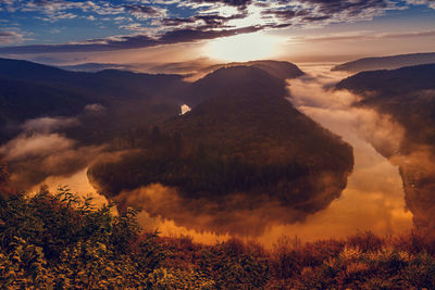 Scenic view of mountains against sky during sunset