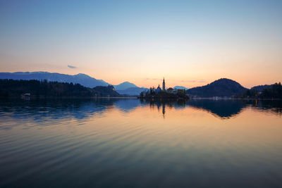 Scenic view of lake against sky during sunset