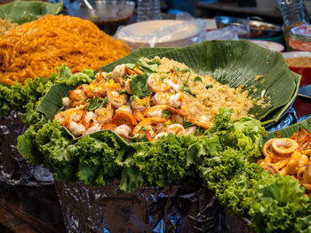 Seafood dish, prawns, shrimps, octopus, squids and rice at street food market in bangkok, thailand.