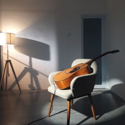 View of guitar on sofa at home