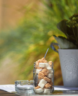 Close-up of drink in glass jar on table