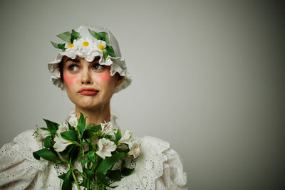 Midsection of bride holding bouquet
