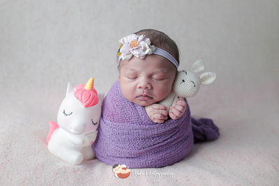 Cute baby girl with toy