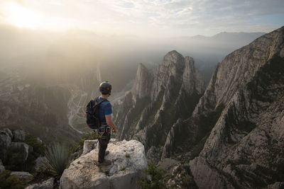 One man standing on a cliff on his way to nido de aguiluchos.