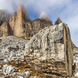 Rock formations on landscape against sky