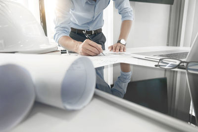 Low section of people working on table