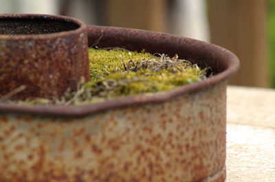 Close-up of rusty metal on table