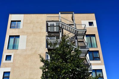 Low angle view of building against blue sky