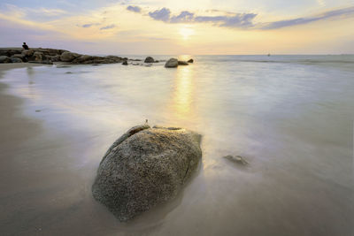 Scenic view of sea against sky at sunset