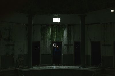 Full length of man standing in abandoned building