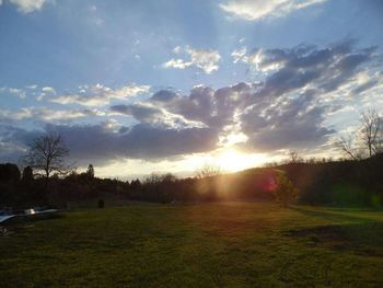 Scenic view of landscape against sky at sunset