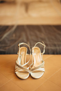 Close-up of shoes on table