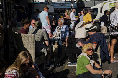 Group of people looking at market