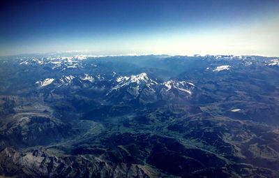 Scenic view of mountains against cloudy sky