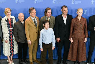 Group of people standing against the wall