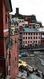 High angle view of buildings in town against sky