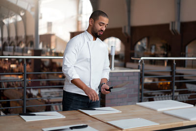 Full length of man working at table