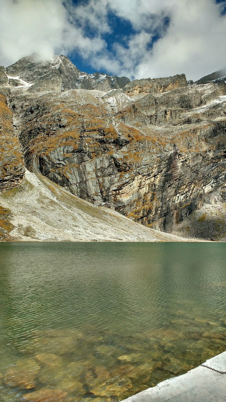 sky, water, cloud - sky, mountain, tranquil scene, tranquility, scenics, nature, beauty in nature, cloud, landscape, cloudy, day, lake, rock - object, sea, outdoors, idyllic, river, non-urban scene