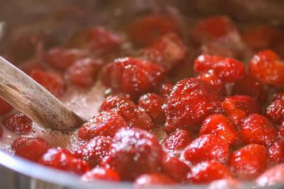 Strawberry jam oreparing process. berries are boiled in a saucepan