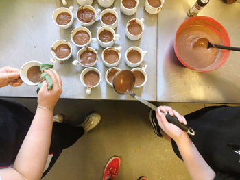 High angle view of woman preparing food on table