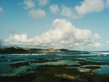 Scenic view of sea against cloudy sky