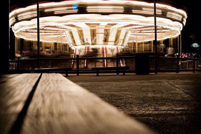 View of empty benches in the dark