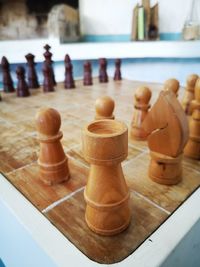 Close-up of chess pieces on table