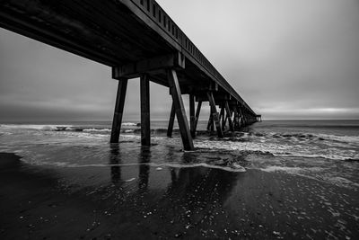 Pier over sea against sky