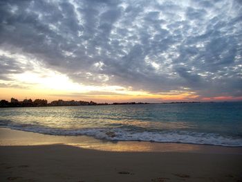 Scenic view of beach against sky during sunset