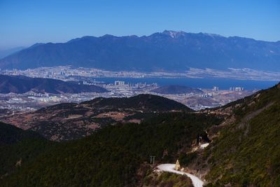 High angle view of mountains against blue sky