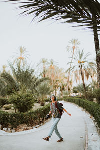 Rear view of woman walking on street