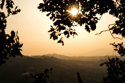 Scenic view of silhouette mountains against sky during sunset