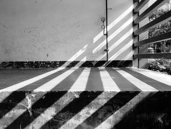 Shadow of railing on street