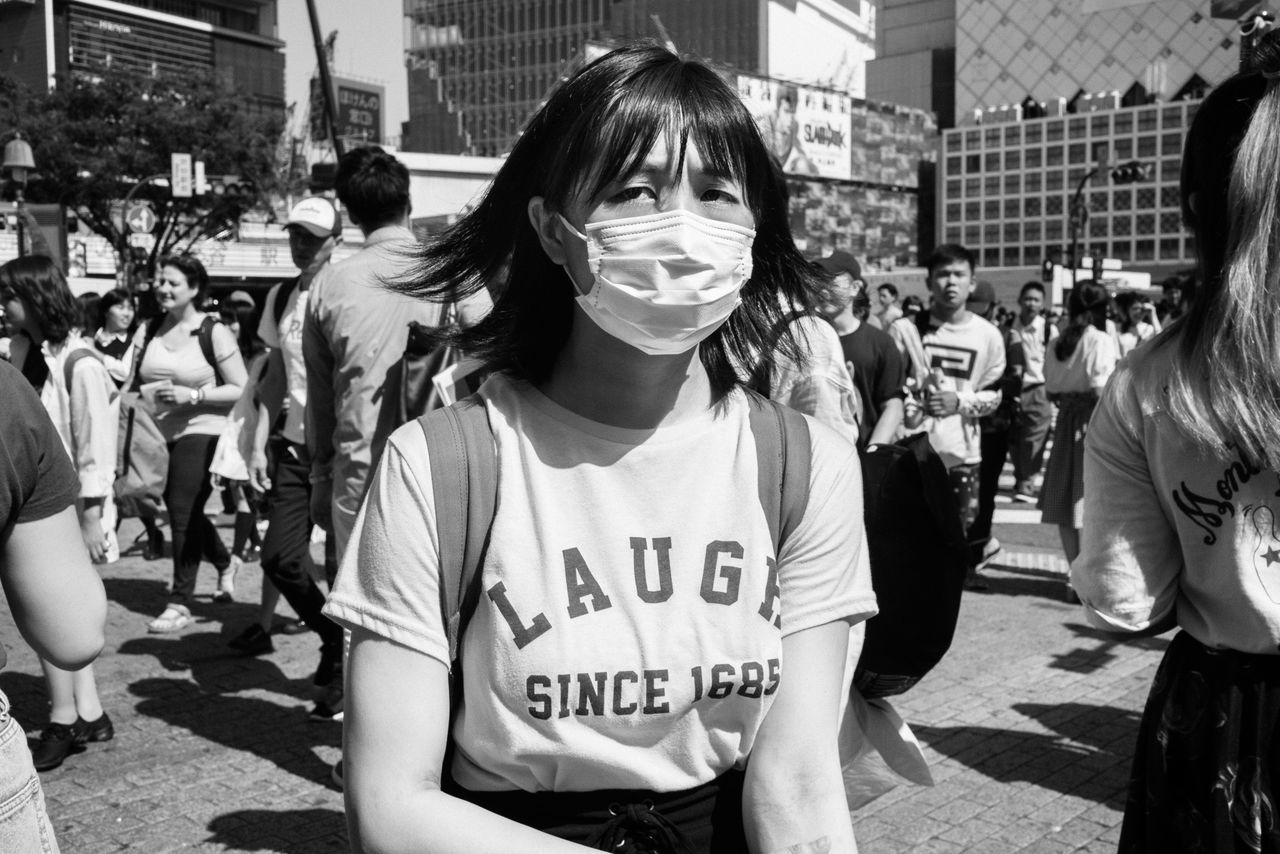 crowd, city, street, group of people, incidental people, real people, large group of people, text, day, architecture, standing, western script, casual clothing, protest, women, protestor, front view, communication, waist up, message, teenager