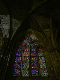 Low angle view of stained glass window of building