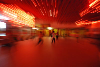 Blurred motion of people in tunnel