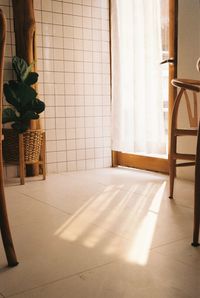 Rear view of woman sitting on chair