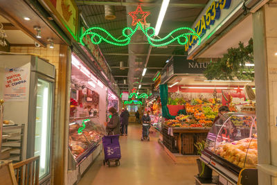 Interior of illuminated market at night