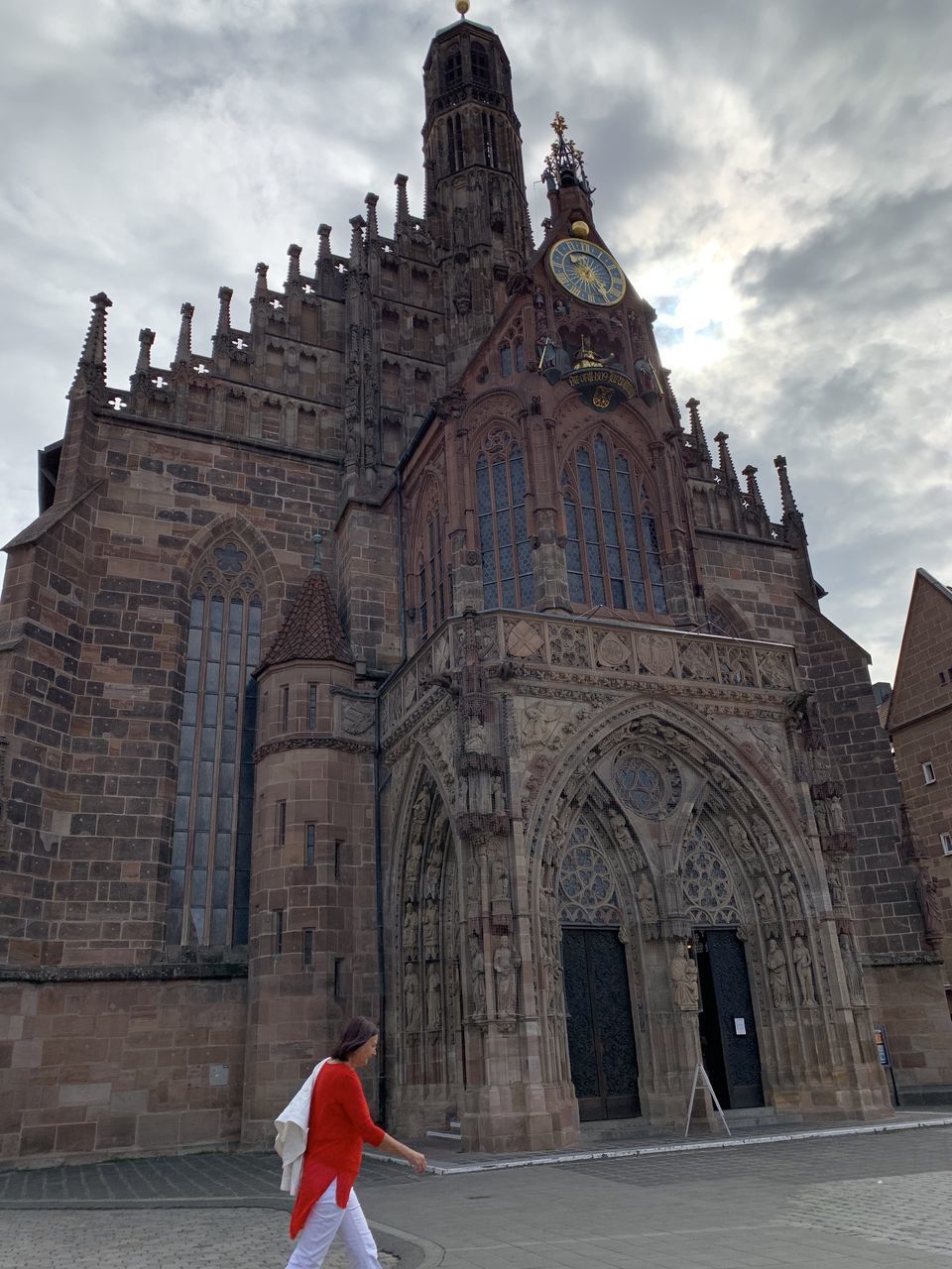 built structure, architecture, building exterior, sky, building, one person, real people, religion, cloud - sky, belief, place of worship, spirituality, the past, women, history, lifestyles, day, adult, arch