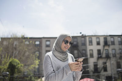 Young woman using mobile phone