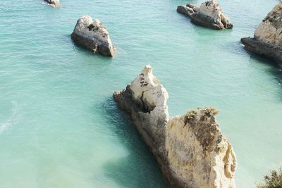 High angle view of rock formation in sea