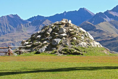 Scenic view of landscape and mountains against sky