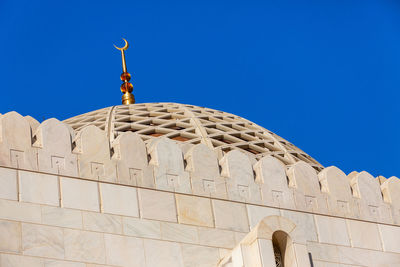 Low angle view of building against blue sky