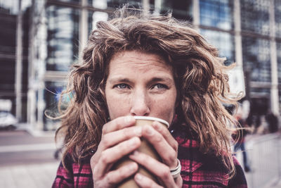 Portrait of man drinking coffee cup