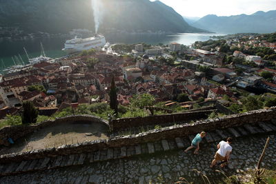 Aerial view of building in town with cruise ship in sea