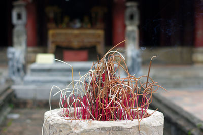 Close-up of cross against building