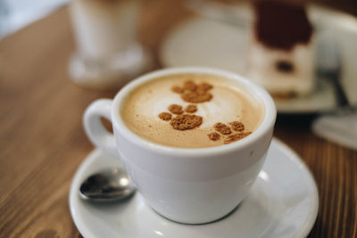 Close-up of cappuccino on table